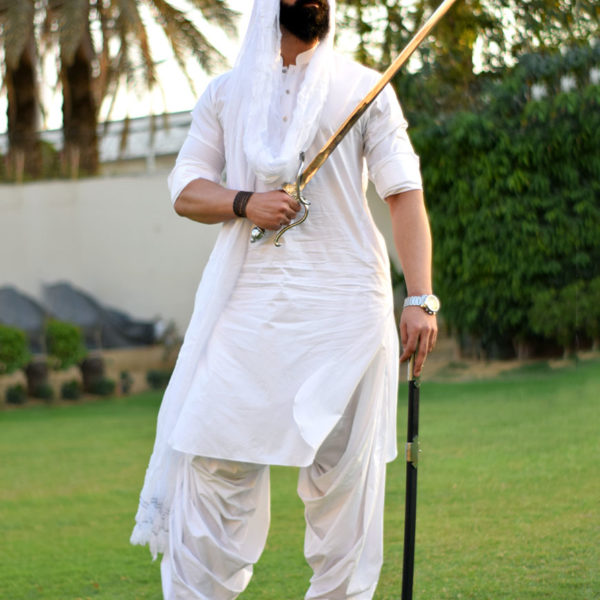 baloch man holding sword - baloch cultural day